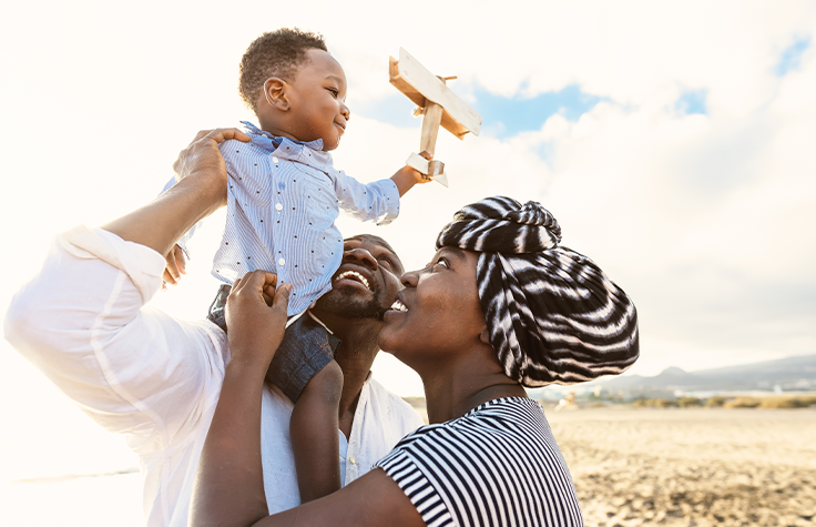 Family-holding-child.